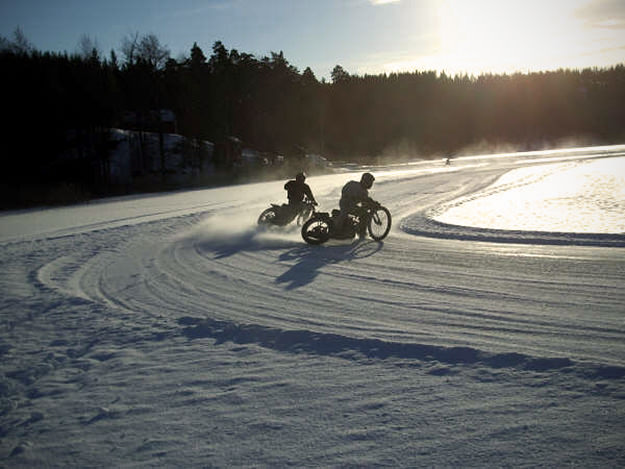 Ice Speedway Patrik Sohlberg and Benny Johansson turning left in Sweden